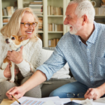 April 25 Events Page Image - Collier Park Elderly man and woman smiling and holding small dog